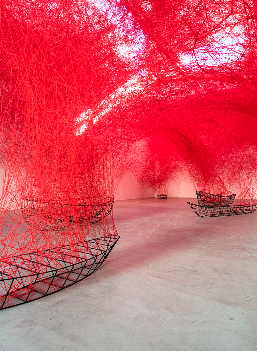 Surreal thread art installation by Japanese artist Chiharu Shiota